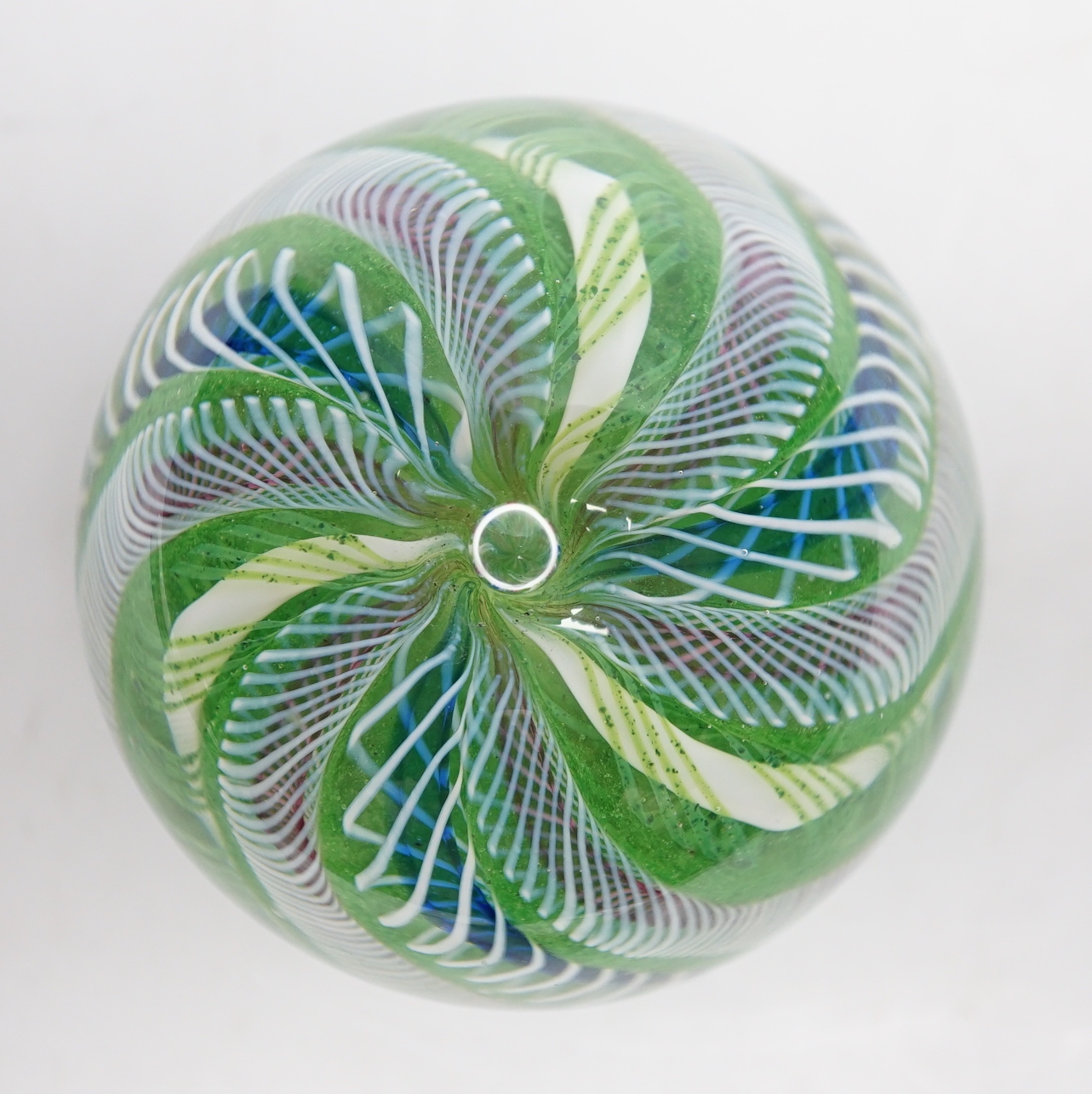 A Paul Ysart latticino swirl crown paperweight, polished concave base, Caithness period, 6.5cm